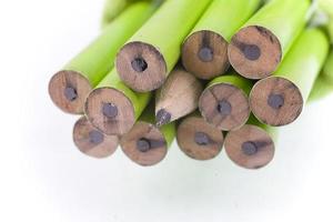 green prepared pencils on white isolated background photo