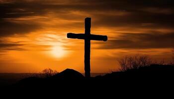 Good friday theme with cross silhouette on golden sunset sky. photo