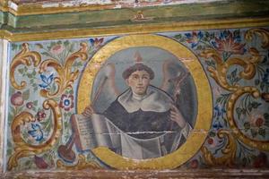 old painted details in a historic Spanish church creating an interesting background in close-up photo