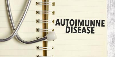 autoimmune disease words on yellow notebook photo