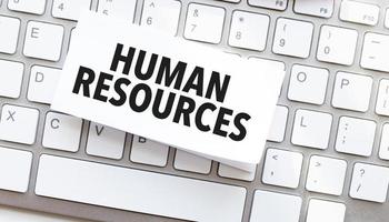 human resources written on paper sheet on a computer keyboard photo