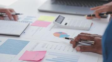 Financial analysts analyze business financial reports on a digital tablet planning investment project during a discussion at a meeting of corporate showing the results of their successful teamwork. video