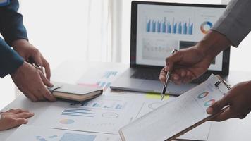 Financial analysts analyze business financial reports on a digital tablet planning investment project during a discussion at a meeting of corporate showing the results of their successful teamwork. video
