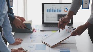 Financial analysts analyze business financial reports on a digital tablet planning investment project during a discussion at a meeting of corporate showing the results of their successful teamwork. video