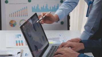 Financial analysts analyze business financial reports on a digital tablet planning investment project during a discussion at a meeting of corporate showing the results of their successful teamwork. video