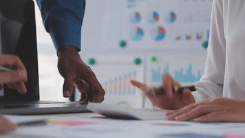 Financial analysts analyze business financial reports on a digital tablet planning investment project during a discussion at a meeting of corporate showing the results of their successful teamwork. video