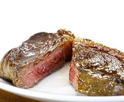 sliced grilled steak served , Picanha photo