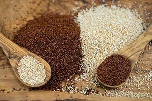 Chenopodium quinoa red or white seed on a wooden table photo