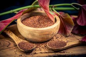 Chenopodium quinoa red or white seed on a wooden table photo