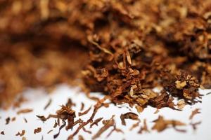 Rolling dried tobacco leafs close up background big size high quality stock photos smoking addict self made cigarettes and joint