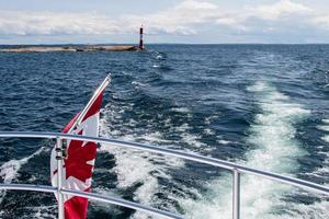 Canadian flag on the back of a boat photo