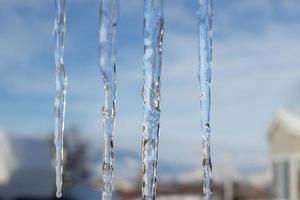 Icicles and blue sky abstract photo