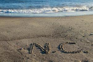 Carolina del Norte escrito en el arena en un norte carolina playa foto