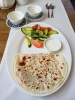 Crimean fried pasties with salad photo