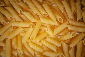 Dry Italian pasta background healthy food photo