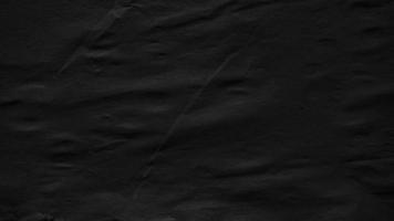 Black crumpled paper grunge texture photo