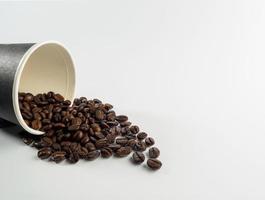 Arabica coffee beans roasted fragrant ready to make coffee that people like to drink placed on the white background looks beautiful photo