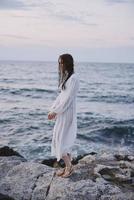 woman traveler white dress standing outdoor relax unaltered photo