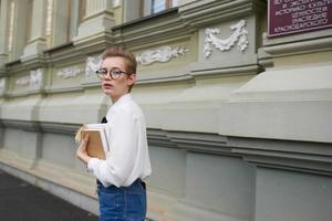 short haired woman on the street near the building rest education photo