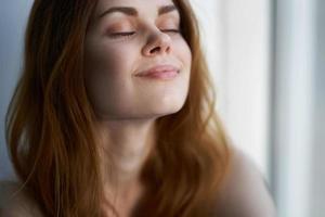 attractive red-haired woman near close-up lifestyle photo