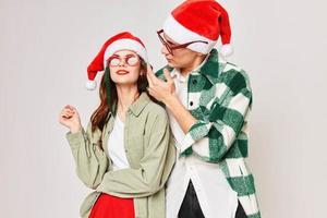 man and woman christmas hat fun holiday christmas sunglasses photo