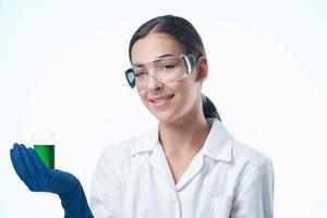 cheerful woman laboratory assistant in a white coat research science diagnostics photo