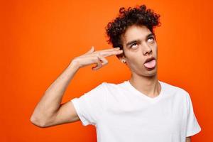 guy with curly hair gestures with his hand emotions modern style photo