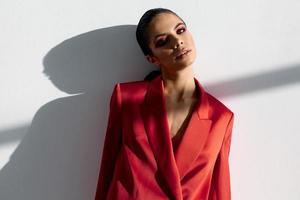 portrait of fashionable woman with evening makeup in red jacket cropped view close-up photo