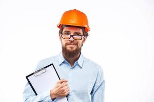 Business man in orange helmet shirt construction security professionals photo