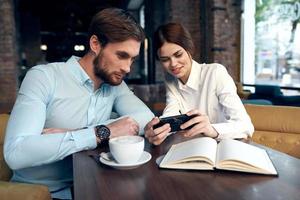 man and woman sitting in cafe breakfast business colleagues photo