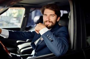 emotional man Driving a car trip luxury lifestyle self confidence photo