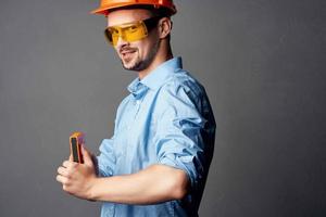 man in orange hard hat Builder emotions Professional photo
