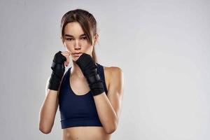 pretty woman hand bandages punch workout fighter isolated background photo