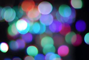 Abstract blurred lights or colorful confetti festive background photo