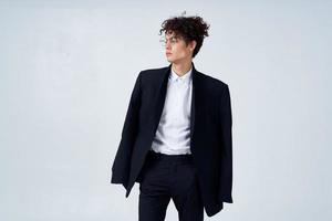 business man in suit glasses curly hair fashion studio photo