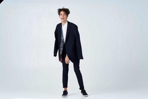 guy with curly hair and a black jacket fashion photo