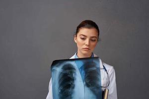 female doctor white coat medicine examination dark background photo