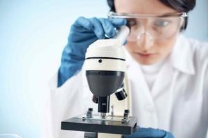 woman laboratory assistant microscope science professional analysis biotechnology photo