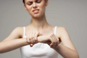 disgruntled woman rheumatism arm pain health problems isolated background photo