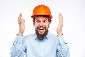 Cheerful male orange hard hat safety professional construction engineer photo