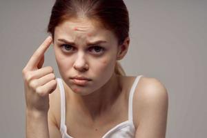 beautiful woman with pimples on the face hygiene isolated background photo