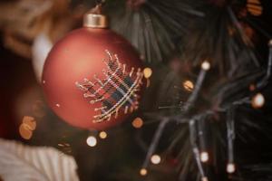 christmas bauble  on a festive background photo