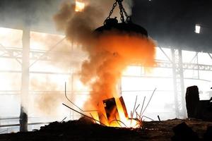 Scrap steel melts down in an induction furnace at Demra, Dhaka, Bangladesh. photo