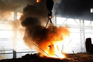 Scrap steel melts down in an induction furnace at Demra, Dhaka, Bangladesh. photo