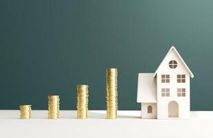 Simple house and gold coins. illustration of saving money to build housing. 3D rendering photo