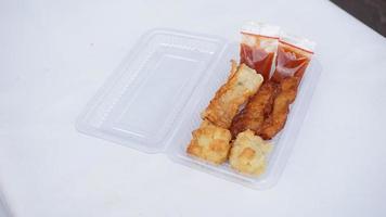 hun Juan, spring roll or lumpia in plastic box on white background,Thai food photo