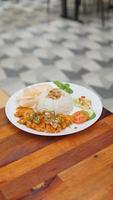 Potrait asian chicken rice with chicken katsu food on the wooden table in the restaurant, stock photo