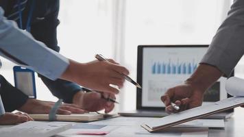 Financial analysts analyze business financial reports on a digital tablet planning investment project during a discussion at a meeting of corporate showing the results of their successful teamwork. video