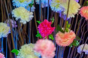 Hand made paper flower stick and colorful lighting. photo