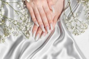 Beauty treatment,  nice manicured woman fingernails. photo